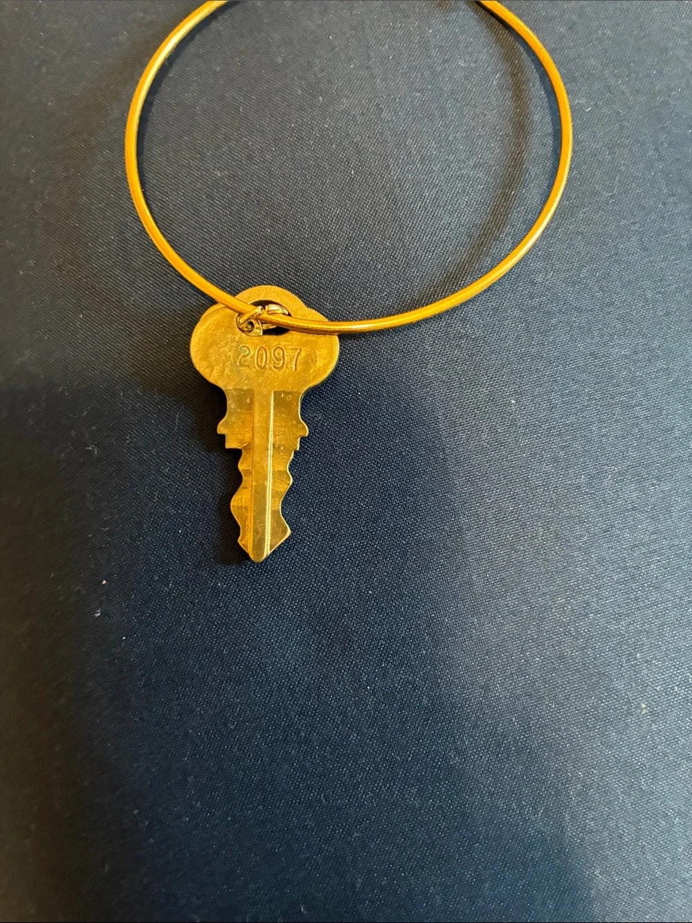 Gold Tone Bangle Bracelet by the “Giving Keys”